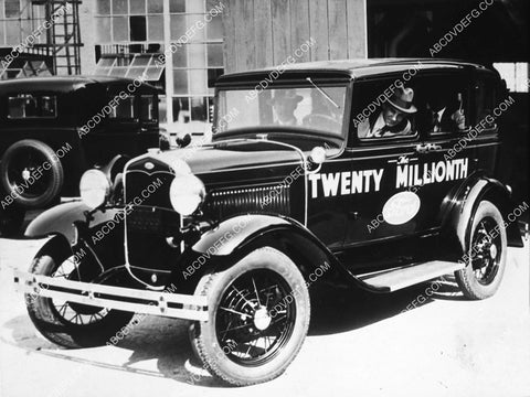 Henry Ford drives off the assembly line in the Twenty Millionth Ford Automobile 2094-31