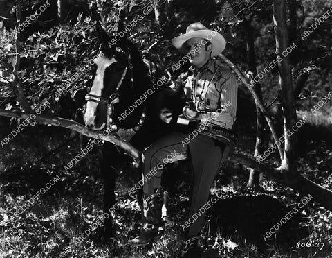 Gene Autry strumming his guitar film Mountain Rhythm 2253-10
