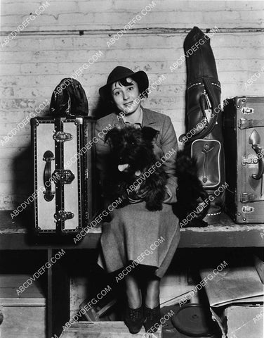 Luise Rainer w her scotty terrier dog and a lot of luggage 2256-12