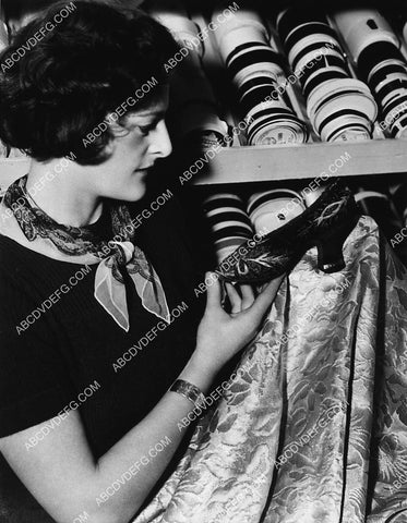 MGM Studios girl working in wardrobe dept selects material 2308-26