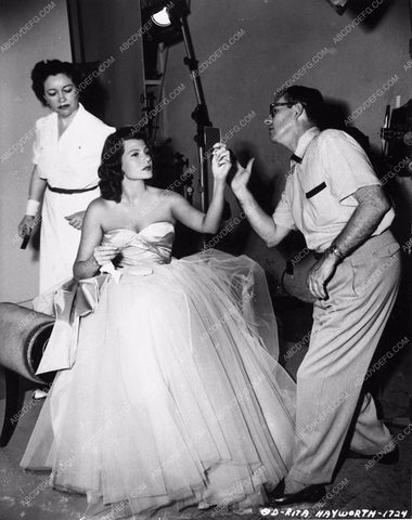 candid Rita Hayworth doing final makeup check before photo shoot 2323b-36