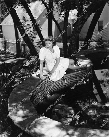 Judy Garland in the backyard by the fish pond 2350-11