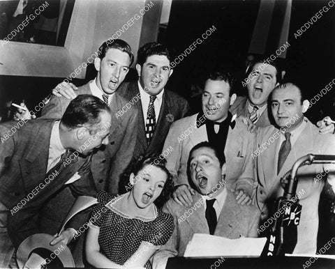 Judy Garland and friends singing away at the piano (is that Jimmy Stewart) 2351-31