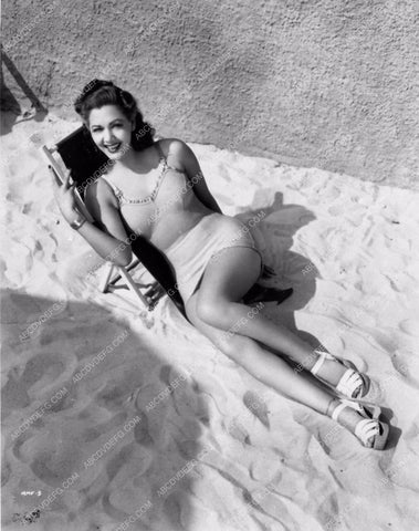 leggy busty cheesecake photo of Maria Montez in the sand 2363-13
