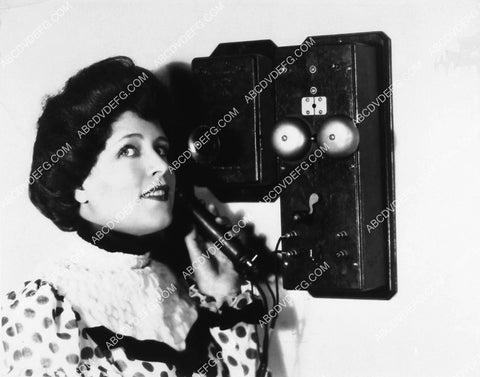 Blanche Le Claire using an 1878 wall telephone 2373-19