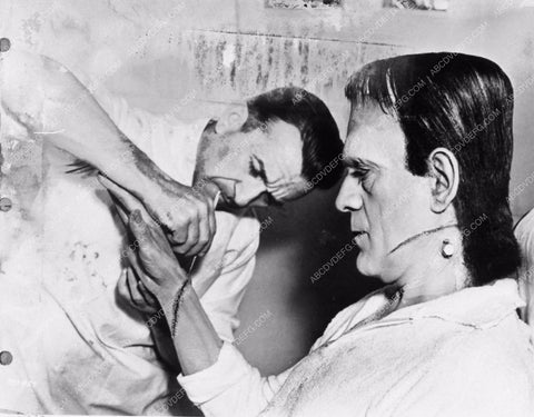 Jack Pierce applying Boris Karloff's Frankenstein makeup behind the sc 2706-23