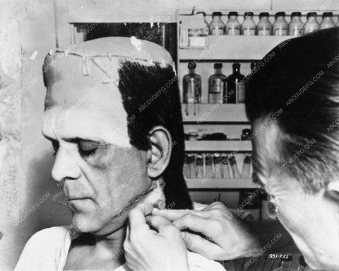 Jack Pierce applying Boris Karloff's Frankenstein makeup behind the sc 2706-25