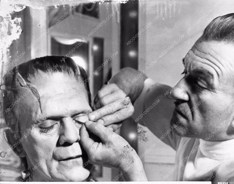 Jack Pierce applying Boris Karloff's Frankenstein makeup behind the sc 2706-33