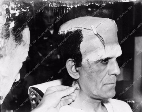 Boris Karloff Frankenstein enjoys a smoke during Jack Pierce's beauty session 2707-30