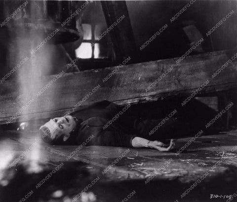 Boris Karloff as Frankenstein monster pinned under timber 2730-24