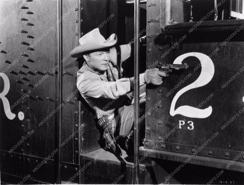 Roy Rogers taking aim at the bad guys 2749-25