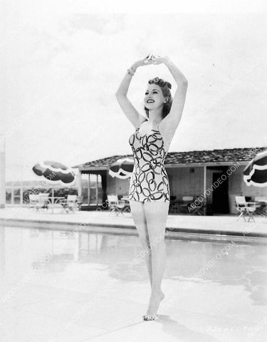 shapely Betty Grable in her new swimsuit by the swimming pool 3030-14