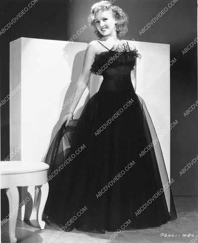 Betty Grable models her new black dress 3030-23