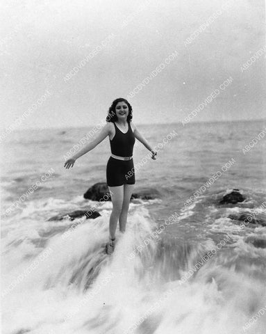 gorgeous Billie Dove in her new swimsuit standing in the waves 3051-18