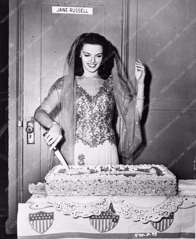 candid Jane Russell cutting birthday cake behind the scenes 3068-03