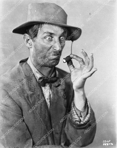 Clyde Cook inspecting his cigar butt 3105-13