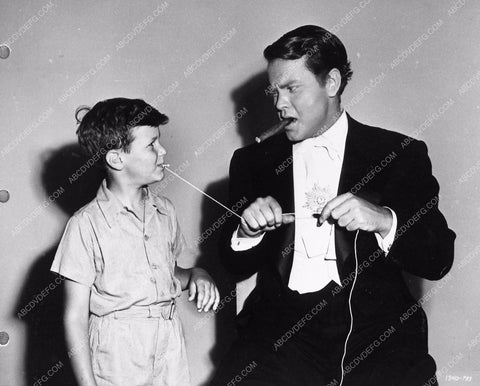 Orson Welles doing magic behind the scenes Follow the Boys 3573-24