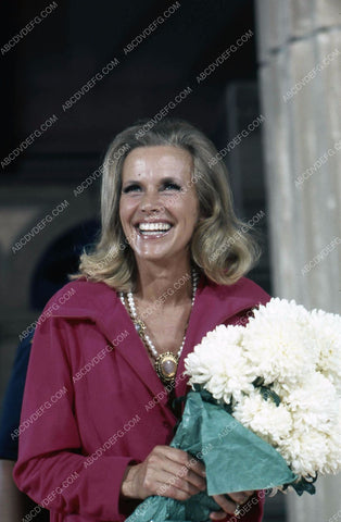 beautiful Honor Blackman with some flowers 35m-873