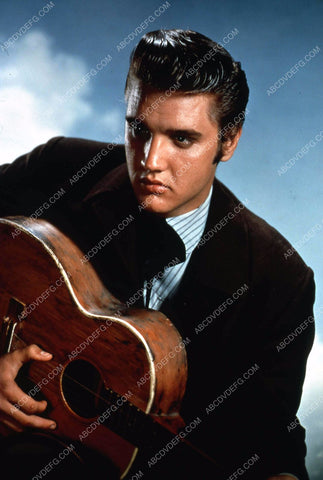 Elvis Presley and his guitar 35m-11334