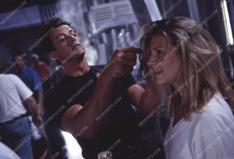 Sylvester Stallone clowning around w the hair stylist maybe on set film Demolition Man 35m-13318
