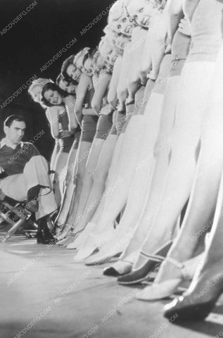 Busby Berkeley inspecting the legs of the chorus girls 35m-13608