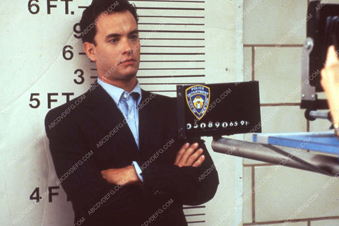 Tom Hanks posing for a mugshot film The Bonfire of the Vanities 35m-13918