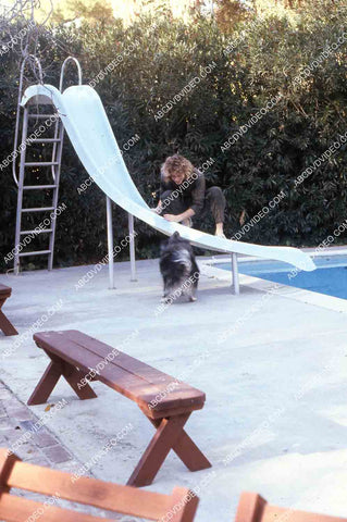 exclusive Leif Garrett sister Dawn Lyn play w dog by swimming pool in backyard 35m-14261