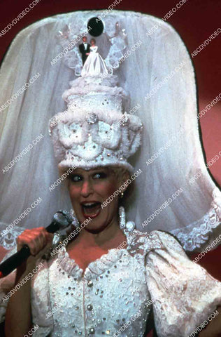 Bette Midler wearing elaborate wedding cake hat Divine Madness 35m-14901