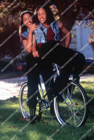 Tia Mowry-Hardict Tamera Mowry-Housley on a bicycle TV Sister Sister 35m-15710