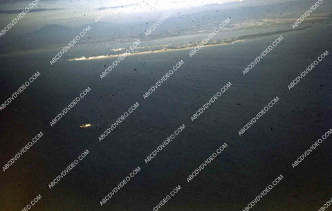 circa 1956 U.S. sailor tours historic Philippines from air in twin engine air force plane 35m-16414