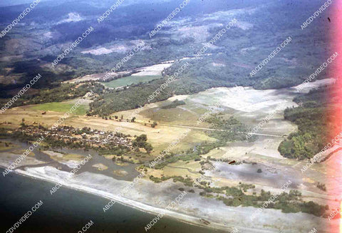 circa 1956 U.S. sailor tours historic Philippines from air in twin engine air force plane 35m-16415