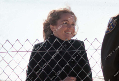 Tuesday Weld behind a chain link fence 35m-17184