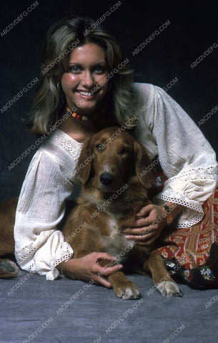 beautiful Olivia Newton-Johnposes with her dog 35m-5453