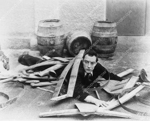 Buster Keaton pops out of broken pickle barrel 3899-19