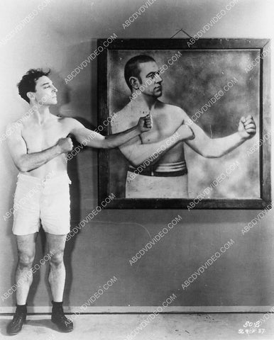 Buster Keaton compares physique to professional boxer 3899-23