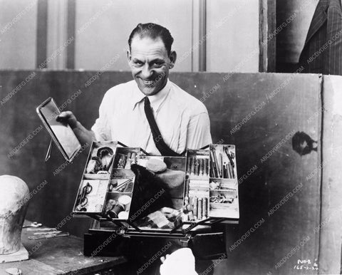 Lon Chaney Sr. testing his makeup skills with his box of tools 3949-34