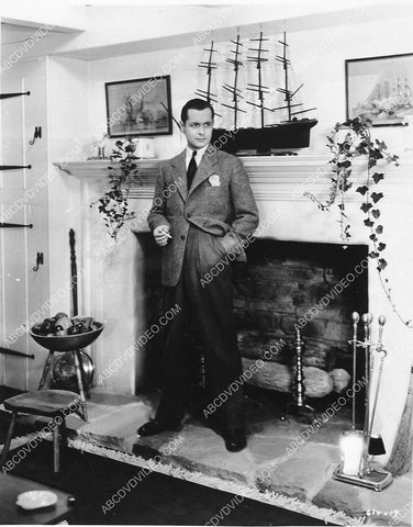 candid Robert Montgomery at home by fireplace 4472-28