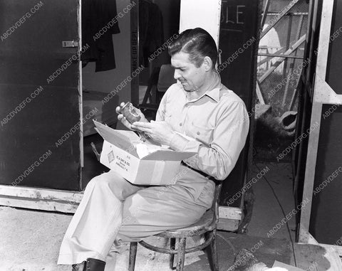 candid Clark Gable receives his pickled pineapples from Honolulu 45bx01-68