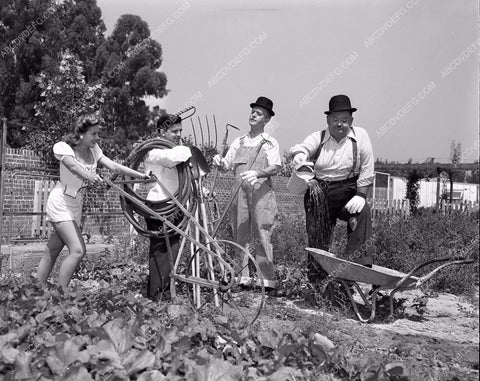 candid Stan Laurel Oliver Hardy tend garden at home in backyard 45bx08-303
