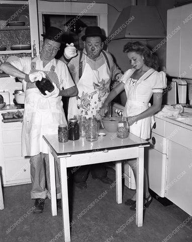 candid Stan Laurel Oliver Hardy tend garden at home in backyard 45bx08-304