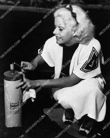 Jean Harlow lighting a "Mine" fireworks device 4722-01