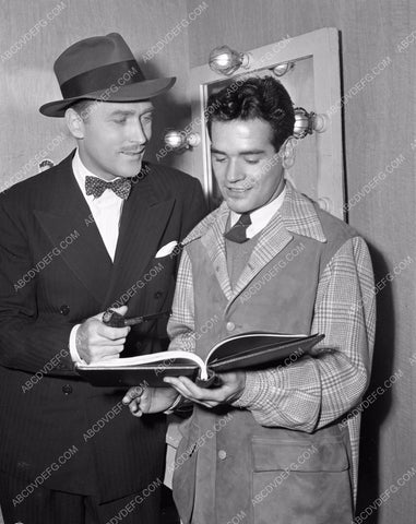 Brian Aherne goes over the script behind scenes Columbia Studios 4b09-346
