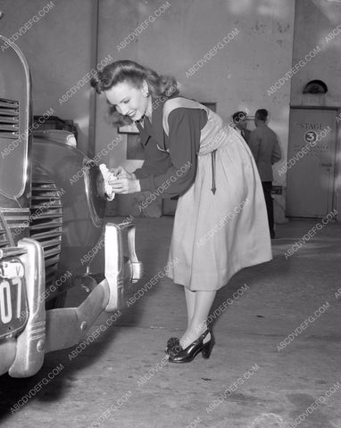 Janet Blair polishes bumpers outside stage 3 4b09-559