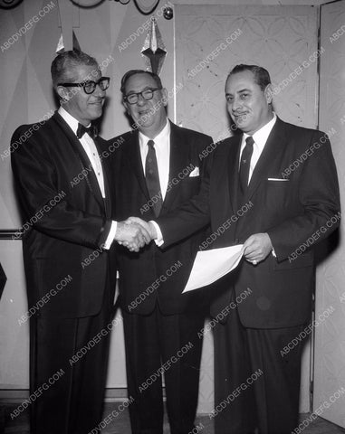 bunch of guys glad handling each other 4b10-029