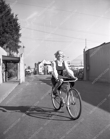 publicity Barbara Moffett riding her bicycle at RKO Studios 4b10-215