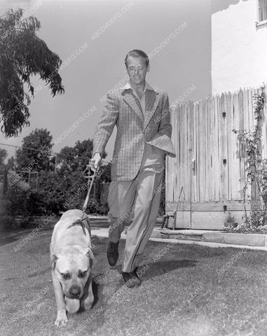 Douglas Fairbanks Jr. enjoys walking his dog 4b10-598