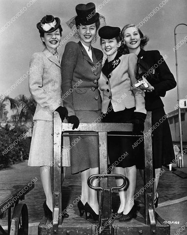 Maria Montez and her three sisters take a ride on luggage transport 5267-20