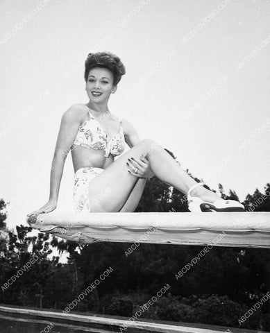 Carole Landis modeling her new swimwear in the backyard 5481-25