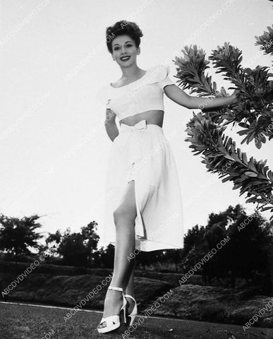 Carole Landis modeling her new swimwear in the backyard 5481-27