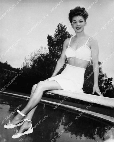 Carole Landis modeling her new swimwear in the backyard 5481-28